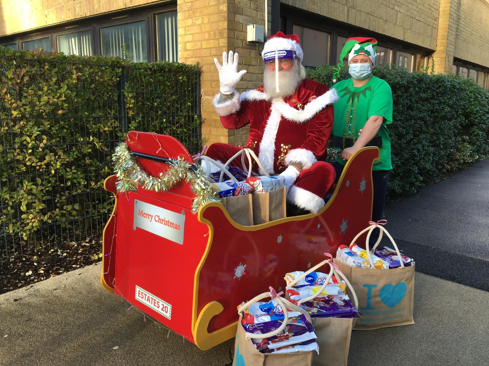 Santa waving in sleigh